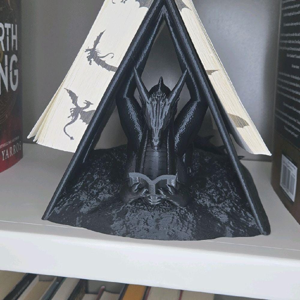 dragon reading book wyrm page holder