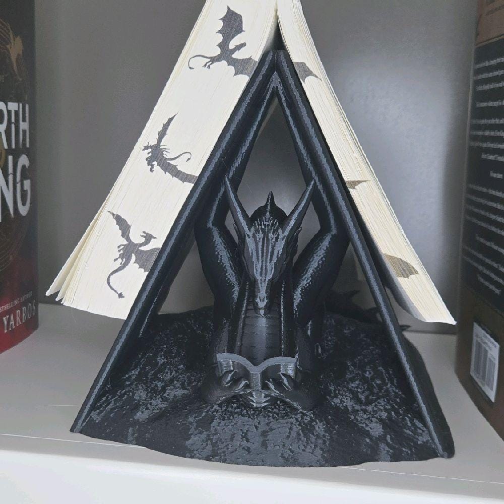 dragon reading book wyrm page holder